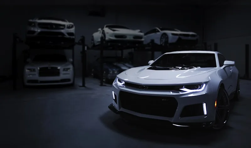Camaro ZL1 and luxury vehicles in Wrap Senators workshop facility in Ottawa