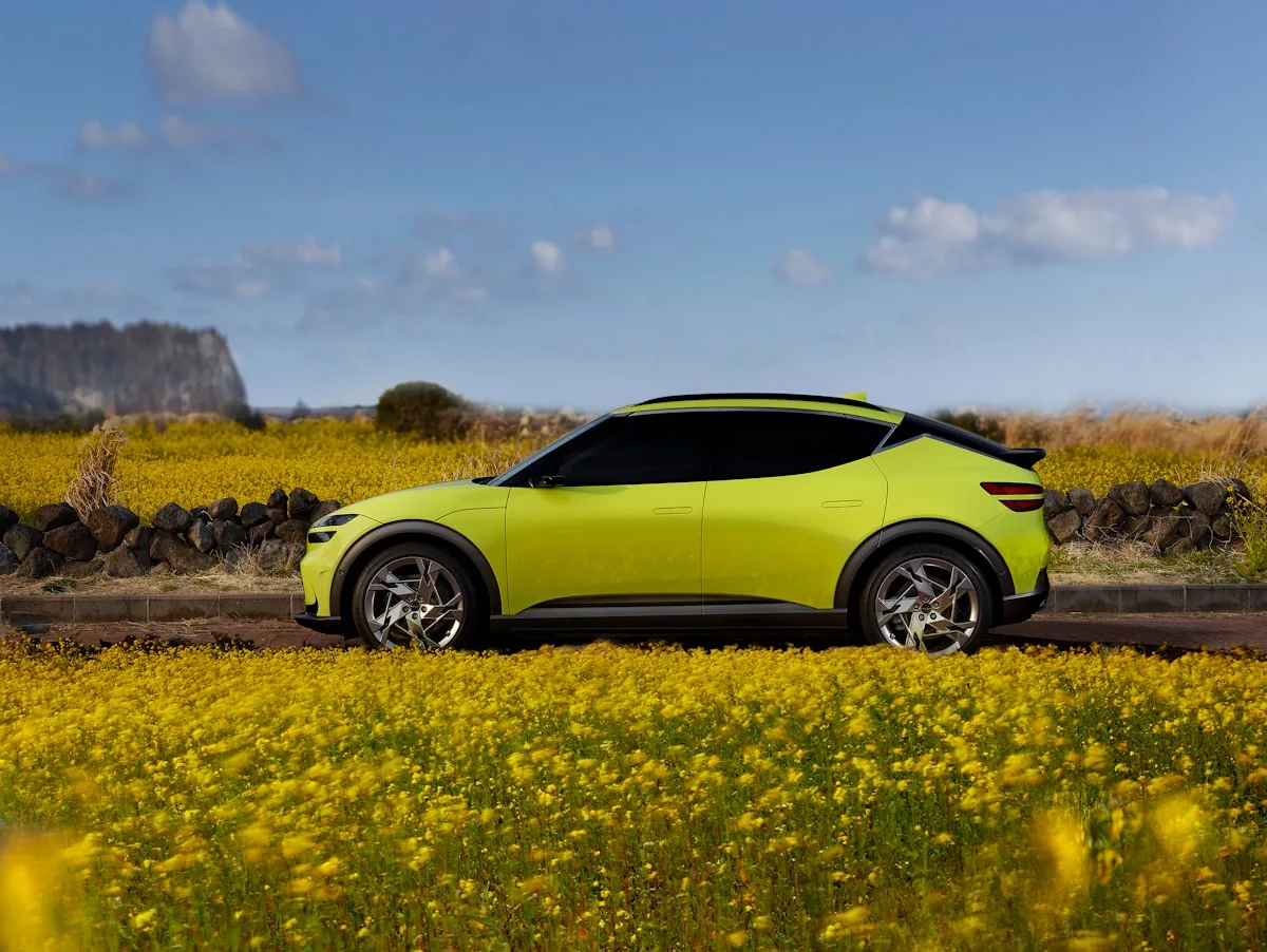 Green electric vehicle in nature representing eco-friendly wrap materials in Ottawa